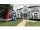 Star Wars bounce house rental in a Houston backyard—15x15 Disney-licensed moonwalk ideal for League City parties with up to 8