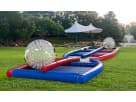 Two-player hamster ball collision course rental in Houston with inflatable track, ideal for ages 4 and up at Spring events.
