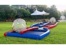 Hamster Ball Collision Course with inflatable zorbs on a Dallas park lawn—interactive obstacle course rental ideal for ages 4