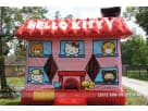 Hello Kitty bounce house rental in Austin with covered sides and netting, ideal for toddler birthday parties in Pflugerville.