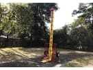 Yellow and red High Striker interactive game rental in Houston backyard with adjustable difficulty, ideal for League City events.