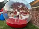Christmas snow globe rental in Austin with holiday lights—ideal for Cedar Park parties and family celebrations.