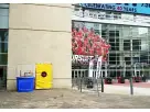 Dunk tank rental in Austin with modern venue backdrop, ideal for interactive party entertainment in San Marcos.