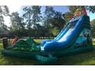 Tiki Falls water slide rental in Austin with attached splash pool, ideal for Buda backyard parties.