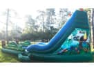 Tropical water slide rental in Austin with built-in pool, perfect for backyard parties in Round Rock.