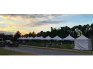 10x10 high peak tent rental in Houston with elegant white frame, perfect for The Woodlands outdoor events accommodating up to 16