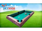 Giant inflatable pool table soccer game rental in Dallas with purple bumpers, ideal for McKinney backyard events.