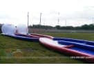 Perfect for Fort Worth birthday parties, this red, white, and blue Hamster Ball Collision Course rental in Dallas features dual