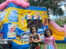 Ice cream truck bounce house rental in Austin with slide feature, perfect for toddlers and kids' parties in Round Rock.