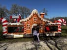 Perfect for Dallas holiday parties, this gingerbread bounce house rental features dual slides and indoor pop-ups
