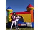Vibrant multicolor bounce castle rental in Austin features dual towers perfect for Leander celebrations.