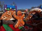 Gingerbread Wonder Playland bounce house rental in Dallas with built-in slide and popups, ideal for holiday parties in Arlington.