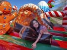 Gingerbread Wonder Playland bounce house rental in Dallas with slide and popups, ideal for Fort Worth holiday parties.