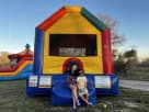 Colorful Funhouse Jumper bounce house rental in Houston with slide, ideal for small backyards and toddler parties in League City.