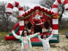 Perfect for Austin holiday parties, this Christmas Candy Cane bounce house rental features festive red and white design