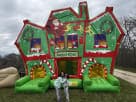 Christmas Holiday Maze bounce house rental in Austin with dual slides, perfect for holiday parties and outdoor events in San