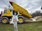 Perfect for Dallas birthday parties, this yellow dump truck bounce house rental features a wet-or-dry combo slide