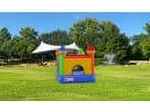 Colorful tiny castle bounce house rental in Dallas with indoor/outdoor setup, perfect for Grand Prairie birthday parties.