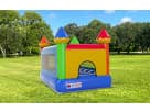 Small indoor/outdoor bounce house castle rental in Dallas with bright rainbow colors, perfect for Garland birthday parties