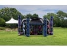 8-person Battle Dome laser tag arena rental in Dallas with neon geometric design, ideal for Plano team-building events