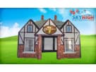 Tudor-style inflatable pub rental in Houston with brick detailing, ideal for college parties and adult events in Pearland.