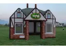 Perfect for Houston birthday parties, this inflatable Pub rental features charming Tudor-style brick and timber design