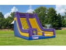 Dual-lane inflatable rockwall and slide rental in Austin, ideal for Cedar Park birthday parties and outdoor events.