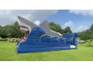 Shark Slip and Slide rental in Austin with dual slides—ideal for Buda summer parties and backyard cooling fun.