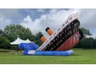 33ft Titanic Adventure dual lane water slide rental in Dallas with orange smokestacks, ideal for large school events