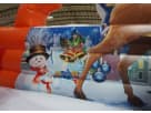 Red and blue Christmas bounce house with snowman and festive bells, ideal for 20ft holiday slide rentals in Dallas and Garland.