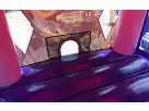 Sofia the First bounce house rental in Dallas with pink castle turrets, ideal for kids 3 and up at birthday parties.