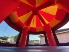 Red and yellow Toy Story jumper rental in Dallas with distinctive cone-shaped panels, ideal for Arlington birthday parties.
