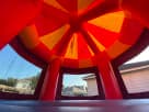 Red and yellow Toy Story jumper rental in Houston with towering cylindrical design, ideal for The Woodlands parties.