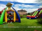 Perfect for Spring birthday parties, this colorful sports-themed bounce house rental in Houston features six interactive games