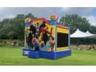 Justice League superhero bounce house rental in Houston—blue, red, and yellow moonwalk ideal for Cypress birthday parties.