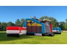 Justice League superhero obstacle course bounce house with dual slides available for rental in Dallas, perfect for Fort Worth