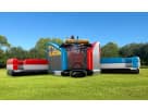 Perfect for Austin birthday parties, this Justice League obstacle course rental features dual slides and a rock wall