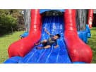 Perfect for Dallas parties, this Justice League bounce house rental features a wet or dry slide combo with dual slides