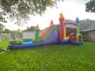 Colorful rainbow bounce house combo with wet or dry water slide rental in Dallas backyard, ideal for McKinney parties.