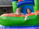 Perfect for Dallas summer parties, this Modern Rainbow water slide bounce house rental features wet or dry functionality