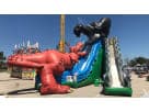Dinosaur and gorilla combo obstacle course rental in Austin with dual slides, ideal for Buda parties and kids ages 3 and up.