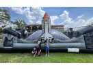 Rocket-themed bounce house rental in Austin with adjustable air flaps, perfect for kids' birthday parties and San Marcos events.