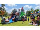 Knights & Dragons Castle wet or dry water slide rental in Houston — perfect for Pearland birthday parties.