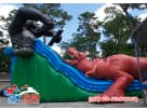Double-slide T-Rex and gorilla obstacle course rental in Austin, perfect for kids ages 3 and up with thrilling 43-foot dry slides.