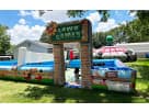 Colorful Games castle bounce house rental in Austin with dual slides and interactive lawn games—ideal for Pflugerville backyard