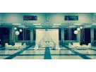 White 8 person lounge furniture set rental in Houston with elegant draping — ideal for The Woodlands indoor and outdoor events.