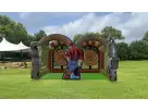 Lumberjack inflatable axe throw game rental in Houston with dual lanes and foam axes, ideal for Sugar Land parties.