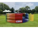 Mechanical Rainbow Shark interactive bounce house rental in Houston with bucking action, ideal for Kingwood parties.