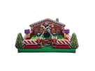 Gingerbread house bounce castle rental in Dallas perfect for holiday parties, featuring candy cane columns and nutcracker