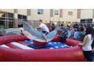 Mechanical shark bounce house rental in Dallas with wave design, perfect for interactive party entertainment in Fort Worth.